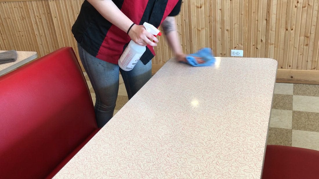 sanitizing restaurant table
